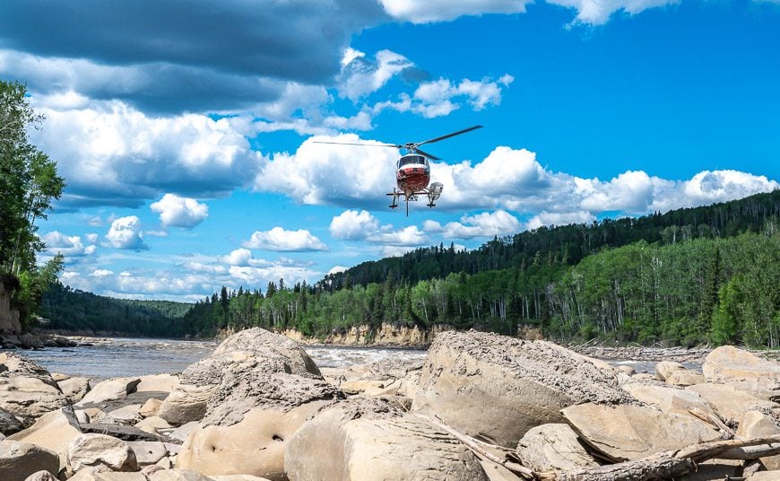 Watching the helicopter come into land beside the river