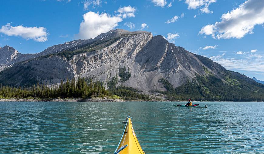 Kayaking Upper Kananaskis Lake is beautiful when the sun is shining