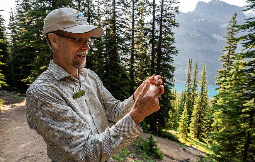 Joel holding a vial of rock flour formed by glaciers