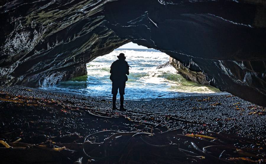 JR checking out the inside of a sea cave