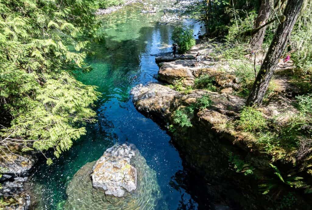 The stunning pools (note the swimmer in a wet suit) below the last the of the falls - a great stop on the Nanaimo to Tofino drive