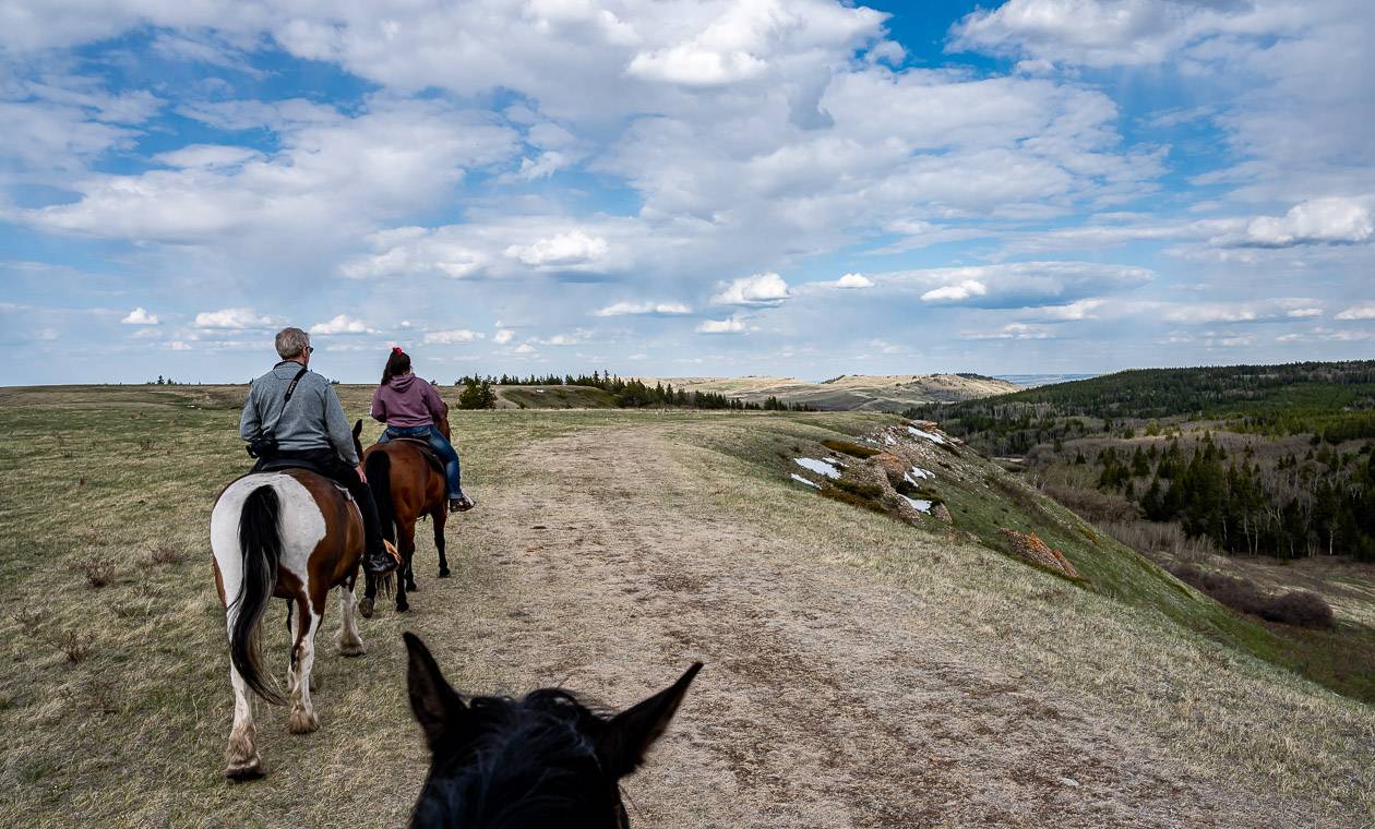 Horseback riding past conglomerate cliffs