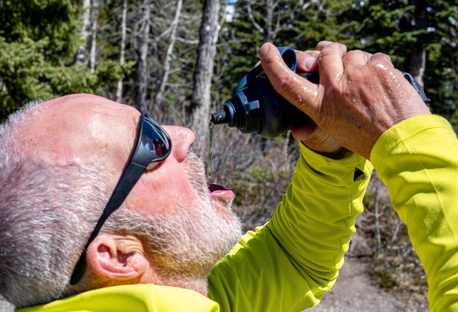 Drinking from the LifeStraw Peak Series Collapsible squeeze bottle water filter system