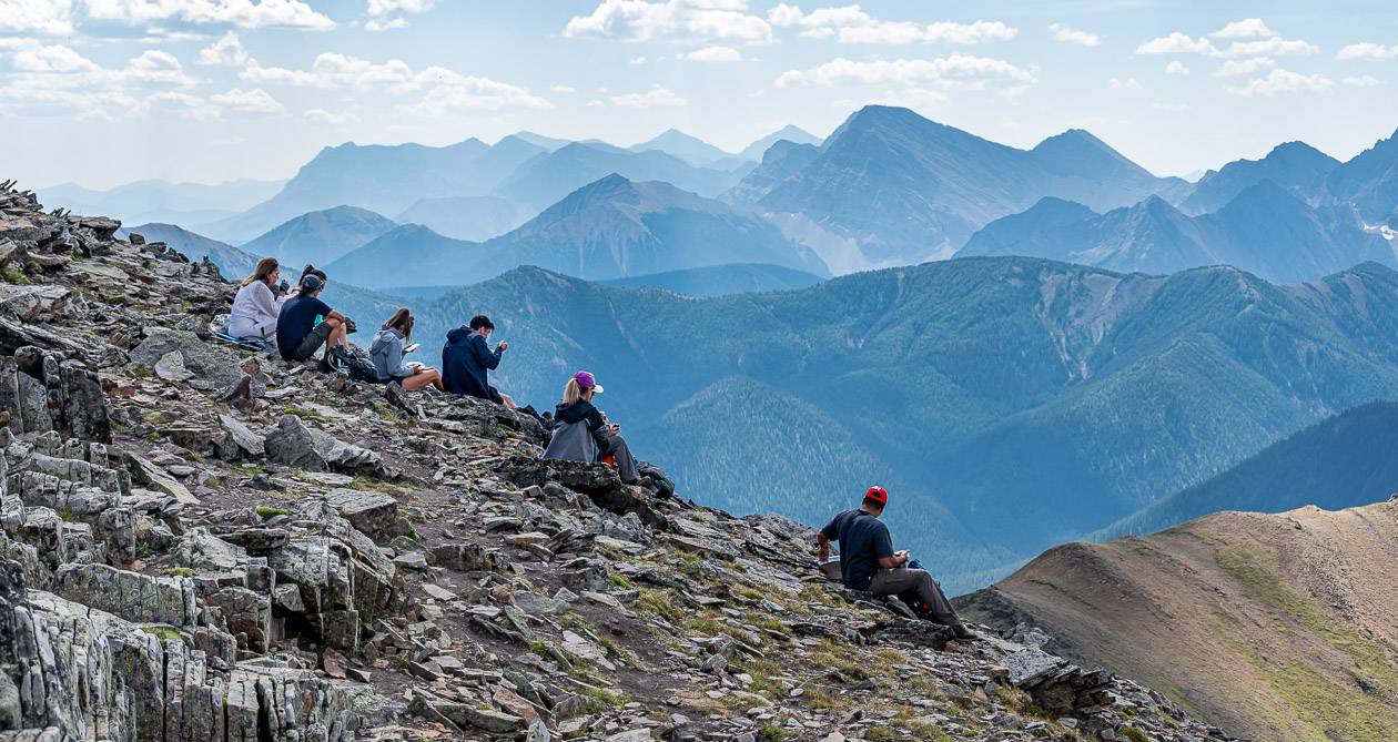 A group enjoying lunch on the Mount Lipsett summit