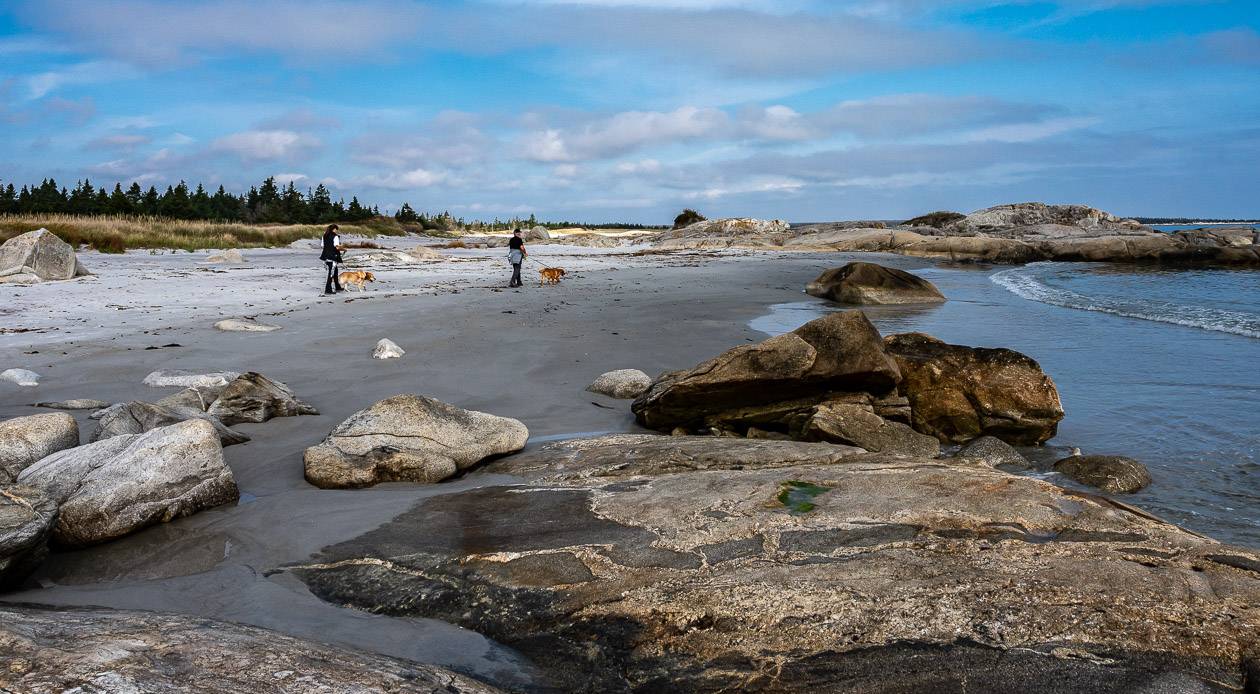 Beautiful walking on a white sand beach at the end of the Harbour Rocks Trail - one of the easy adventures in Nova Scotia