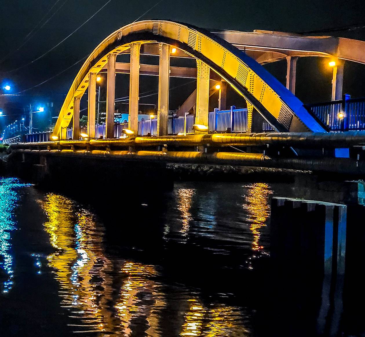 Things to do in Liverpool Nova Scotia including walking the bridge over the Mersey River lit up at night