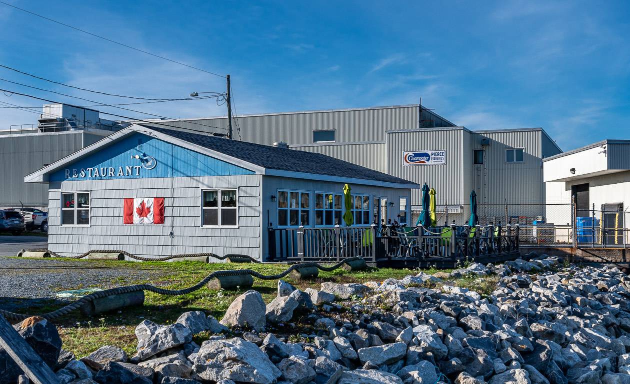 There is a an outdoor patio facing the ocean at White Gull Restaurant & Marina near Shelburne