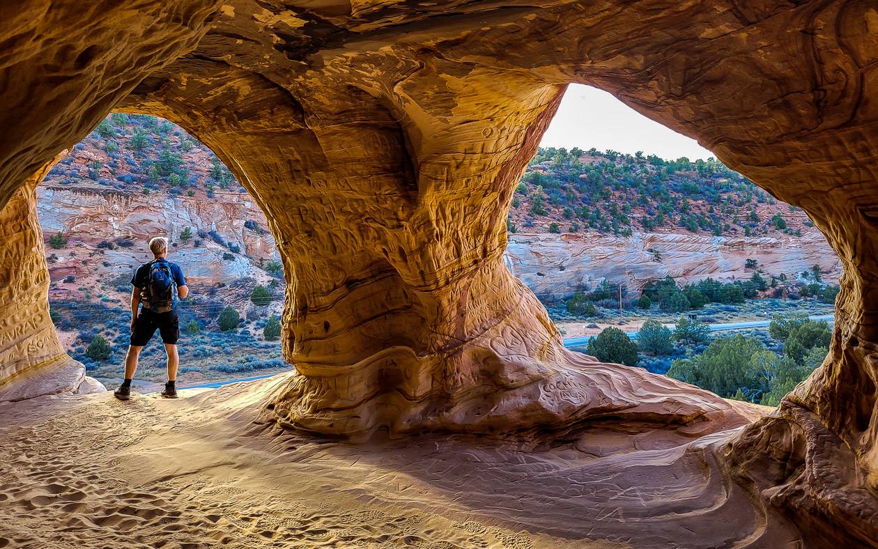 John looking out of the Kanab sand caves to the highway and beyond