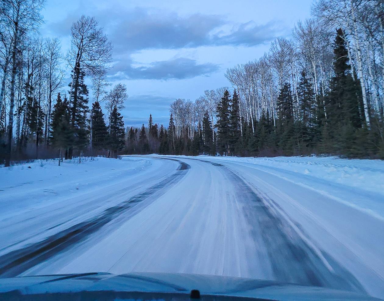 Driving into Prince Albert National Park in winter at dusk