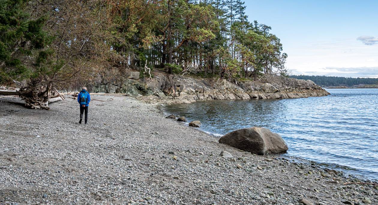 Walking a small beach to Yeo Point