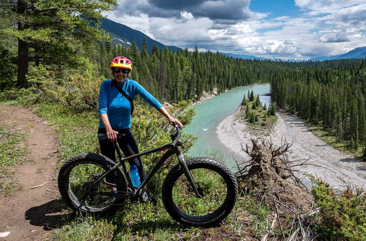 Mountain biking at Nipika Mountain Resort with beautiful views of the Kootenay River as a backdrop