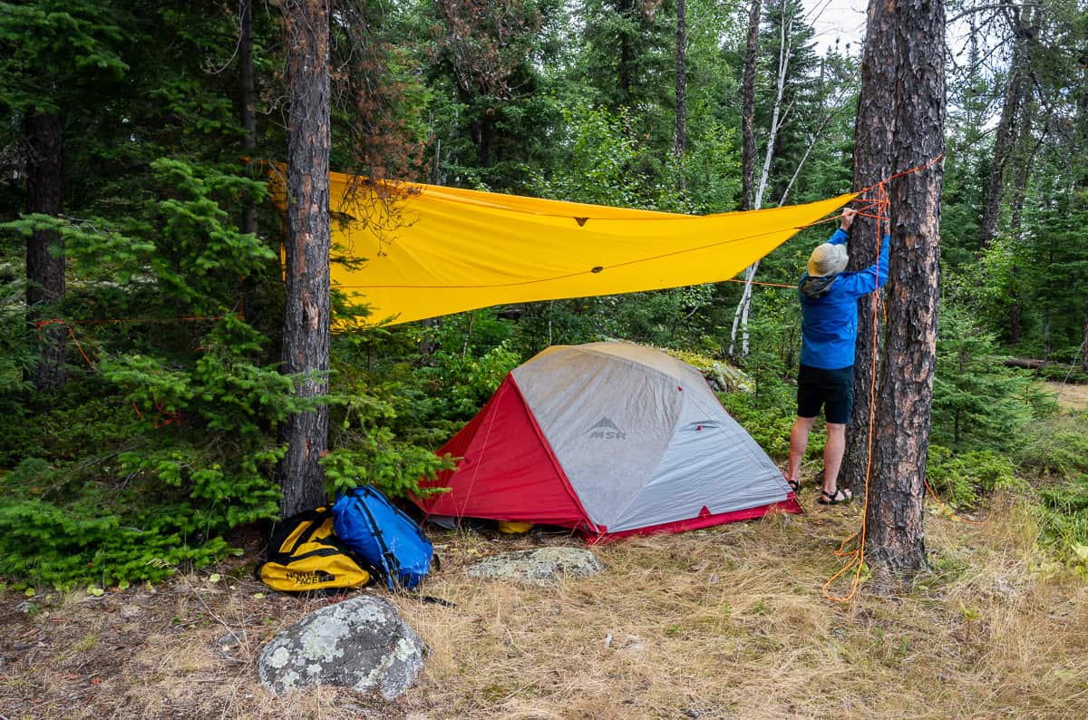 Putting up the Scout Tarp in Woodland Caribou Provincial Park, Ontario