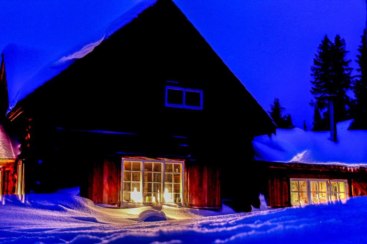The glow of Skoki Lodge in winter