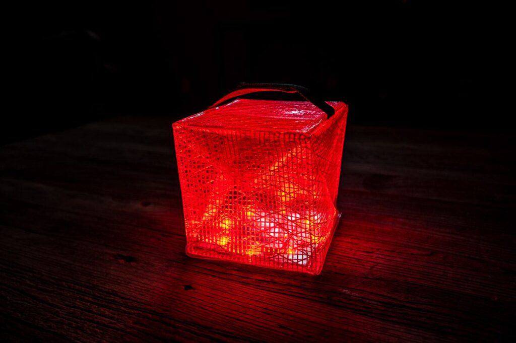 The Megapuff solar lantern with a solar phone charger
