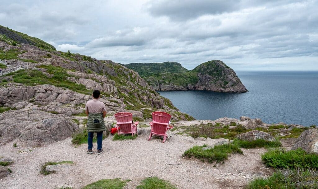 Some people enjoying a Parks Canada red chair moment