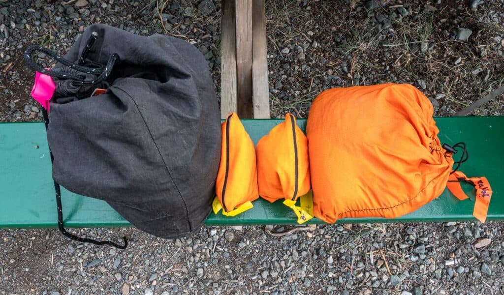 Group gear and food I must carry - the black sack is a bear-resistant ursack