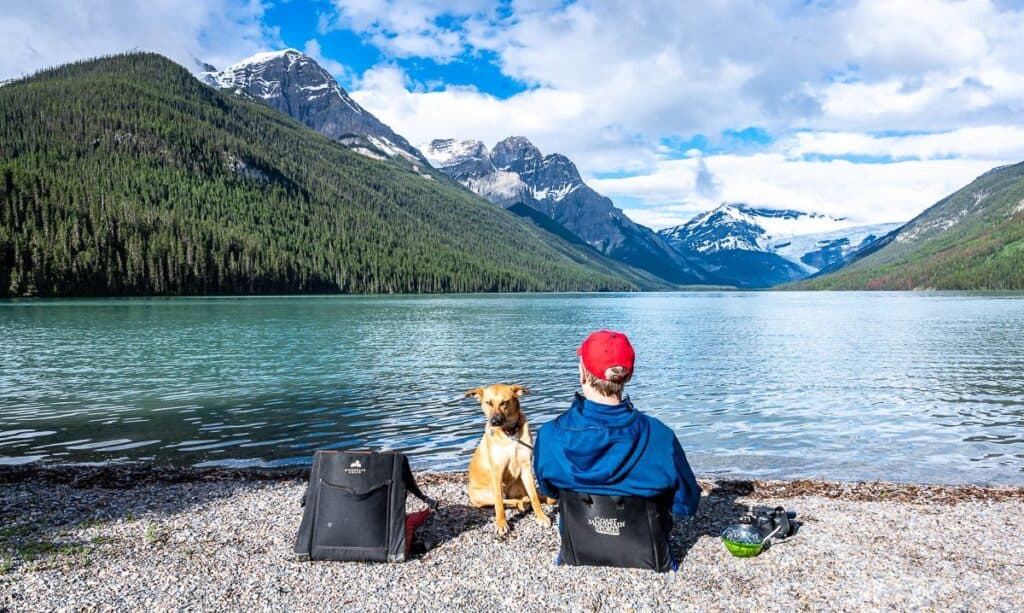 Enjoying breakfast with a view on Glacier Lake - one of the early season backpacking trips in Banff National Park