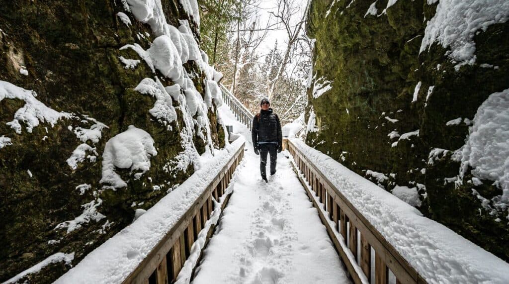 Descend stairs off the Cliff-Top Side Trail to enter a small canyon - one of the fun winter hikes in Ontario 