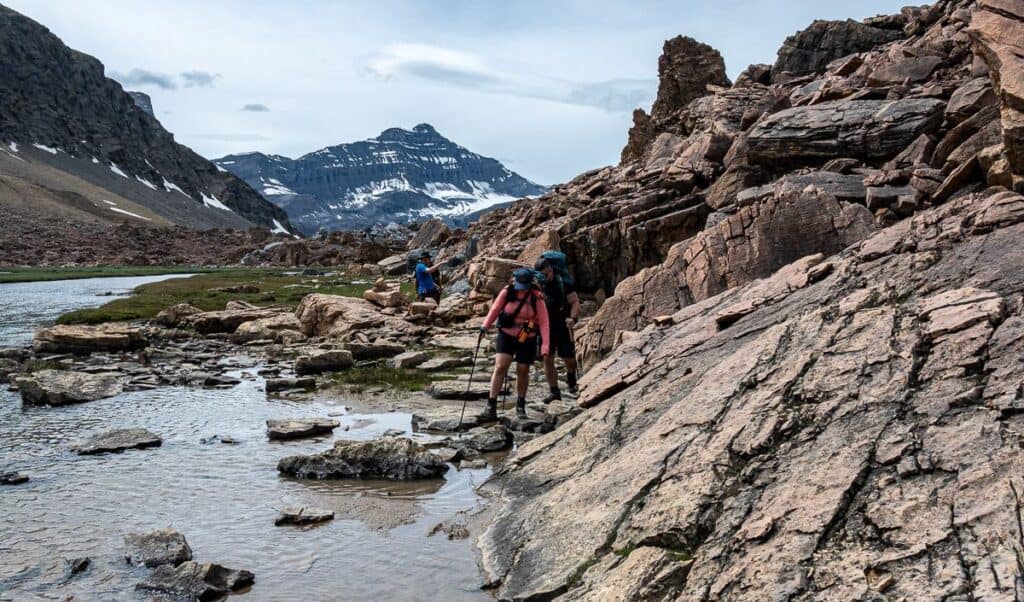 Stay low and hike over the boulders to meet up with a grassy trail