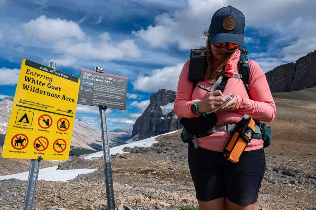 Gemma is signing all of us into a log book at Cataract Pass on the border with Banff National Park and the White Goat Wilderness Area