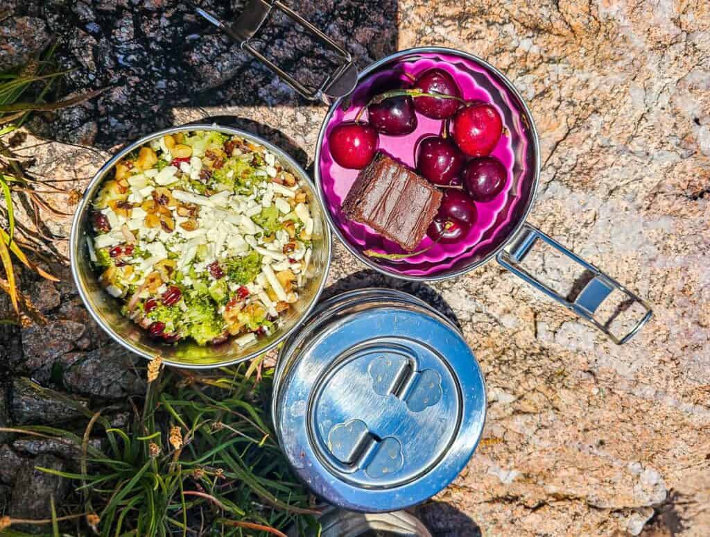 Our three part tiffin tin also contains a broccoli salad, along with a brownie and fresh cherries