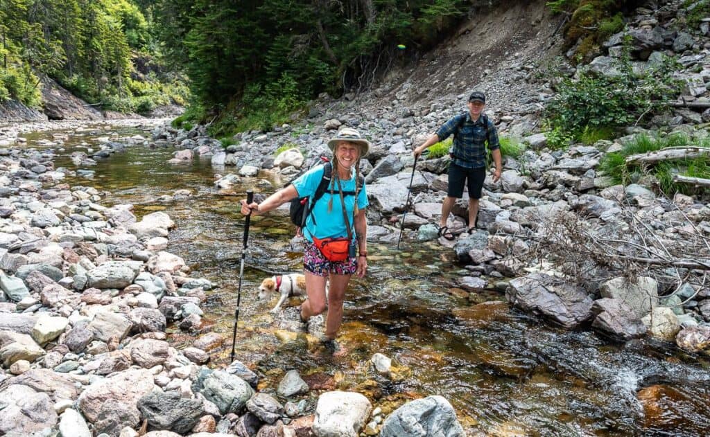 Decked out with grippy waterproof sandals, quick-dry shorts and a t-shirt and a hiking pole for balance