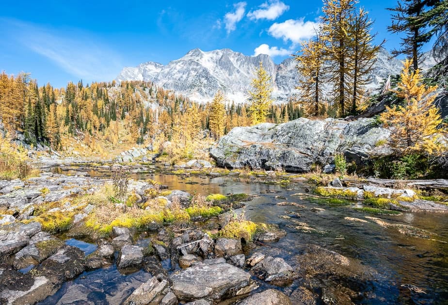 Rock hop across this outlet stream to continue to the second and third lakes below Mt. Amon Ra